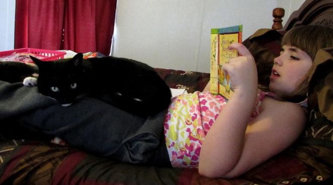 Who needs to hear the Bible read aloud more than the cat?